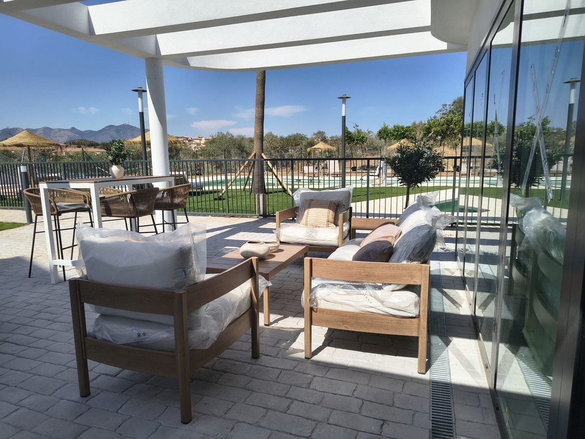 The clubhouse terrace, under its pergola