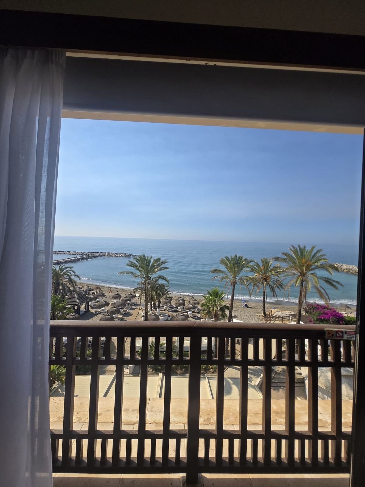 Through the balcony doors