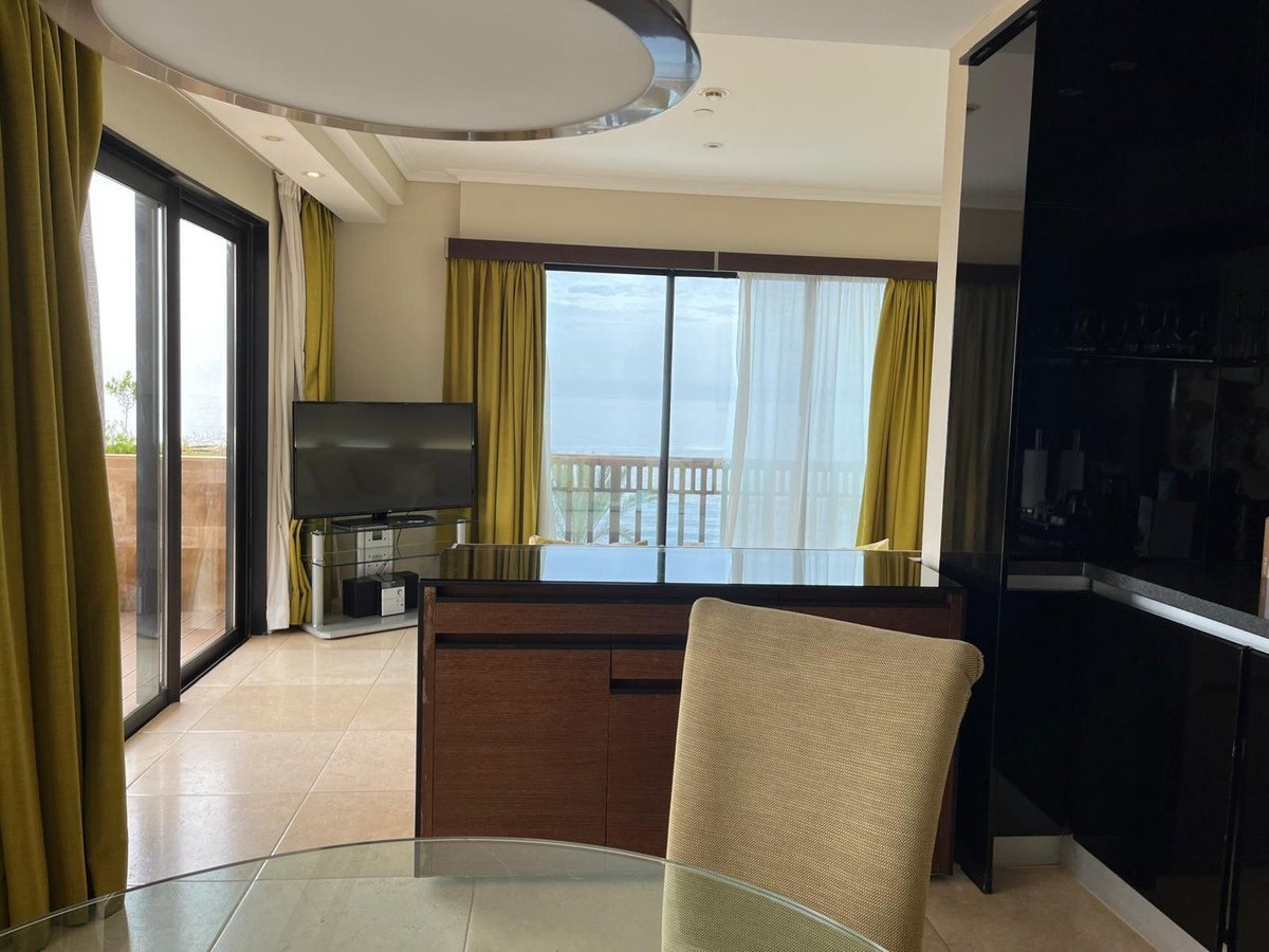 Dining area, with the balcony doors to the sea