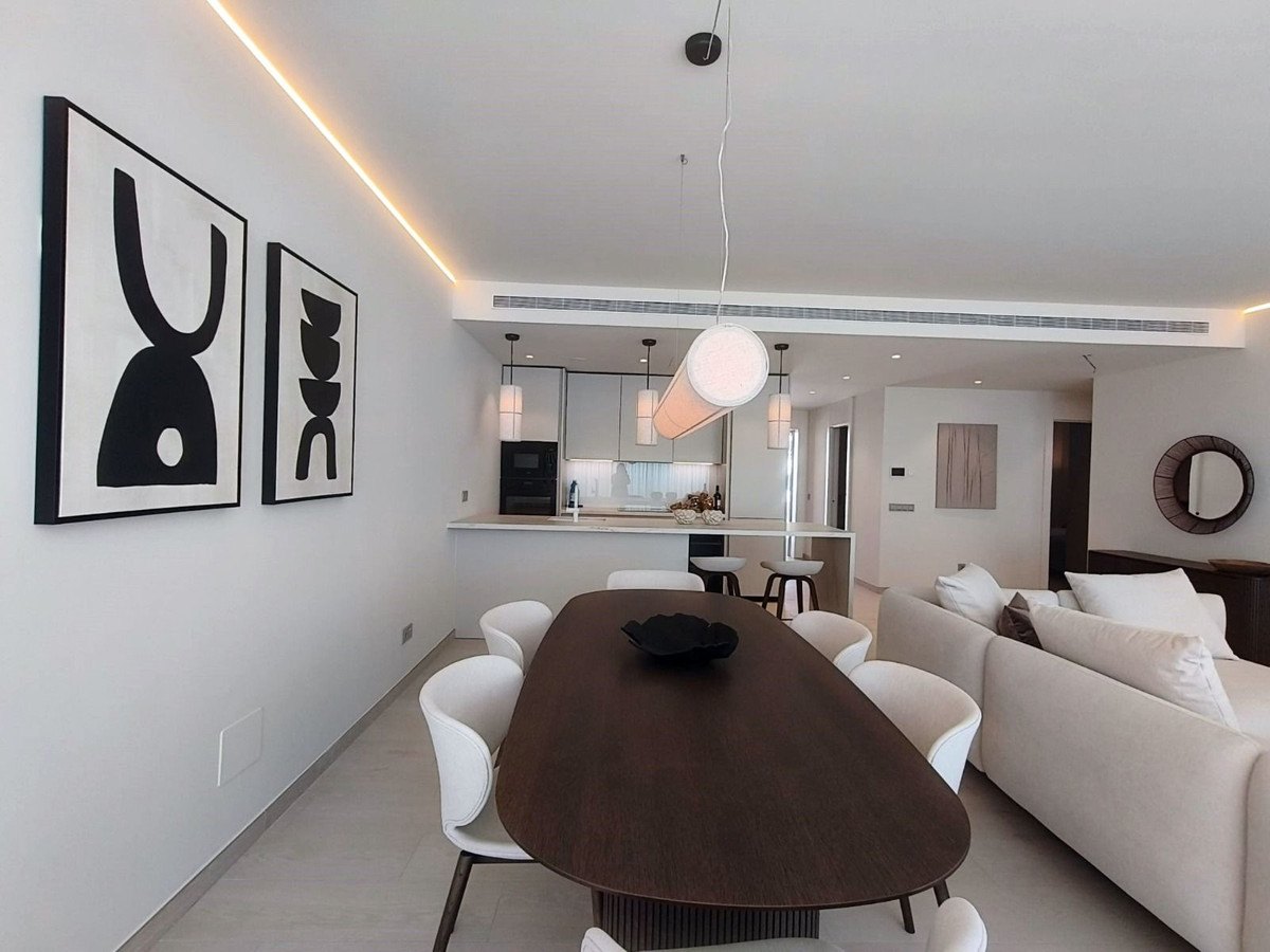 Dining area with framed prints on the wall