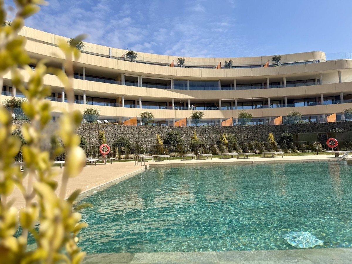 The pool's sandy beach entry