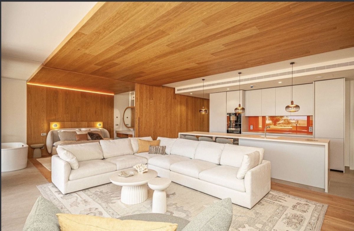 The living room under its timber ceiling