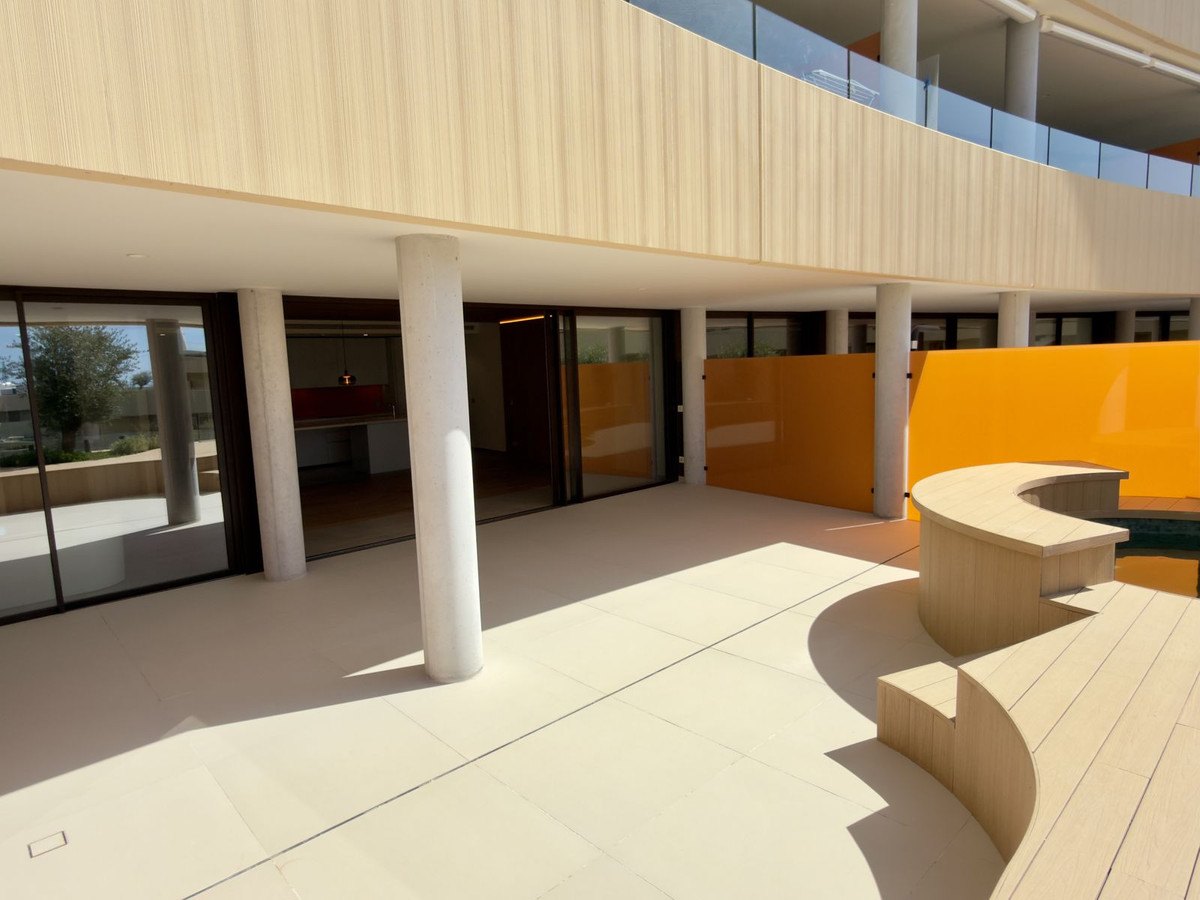 The side terrace behind full-height glass