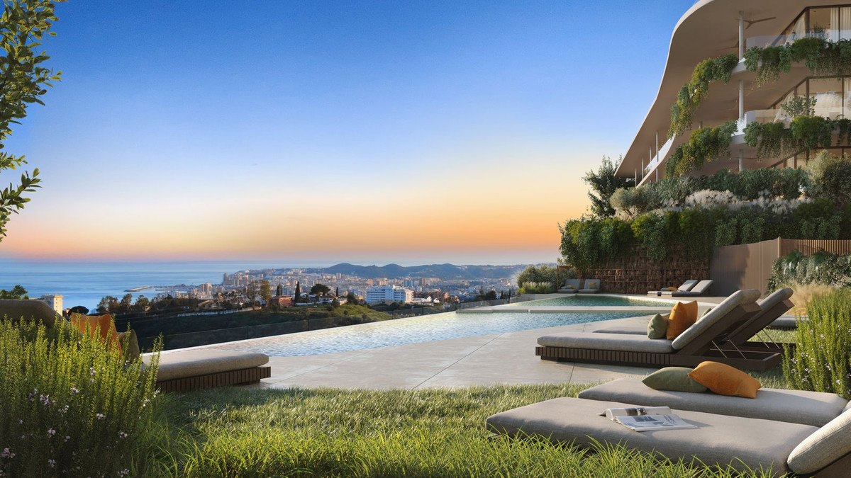 The community's infinity pool at sunset, the coast below — computer-generated image