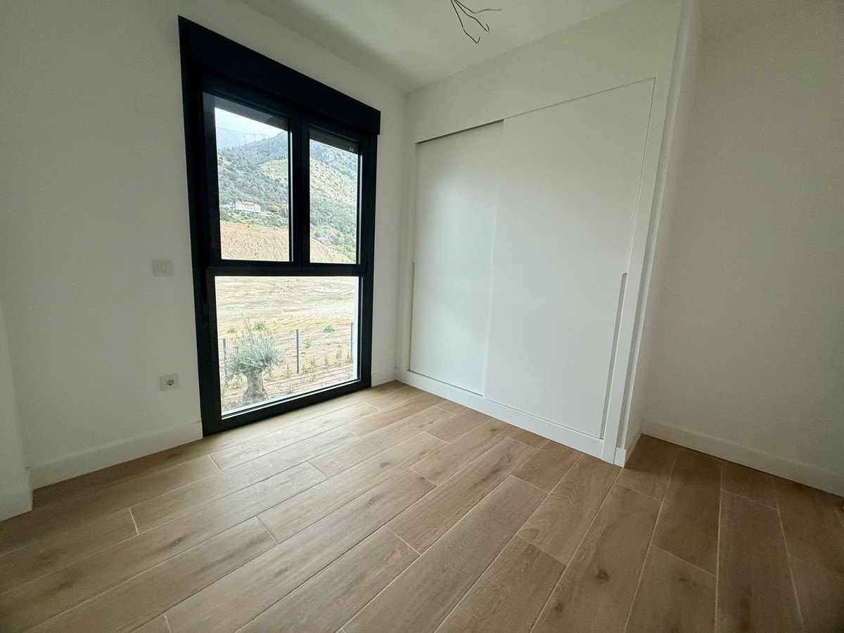 A bedroom with its fitted wardrobe