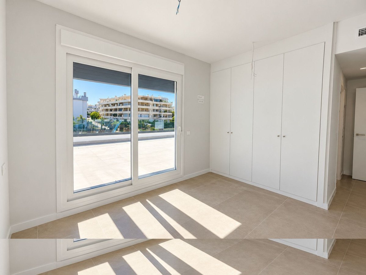 A bedroom with its wide window