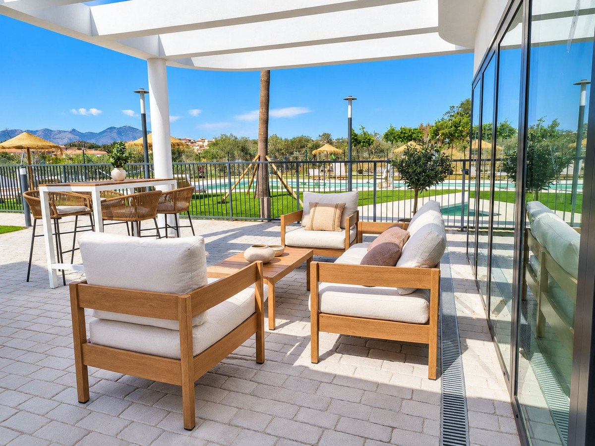 The clubhouse terrace, set out with sofas