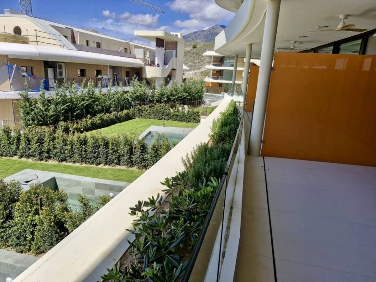 Planted terraces and lawns below the balconies