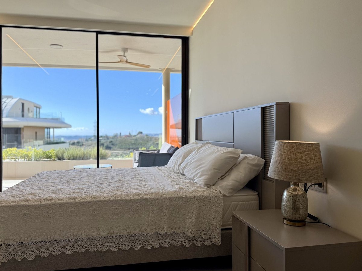 The master bedroom and its wide window