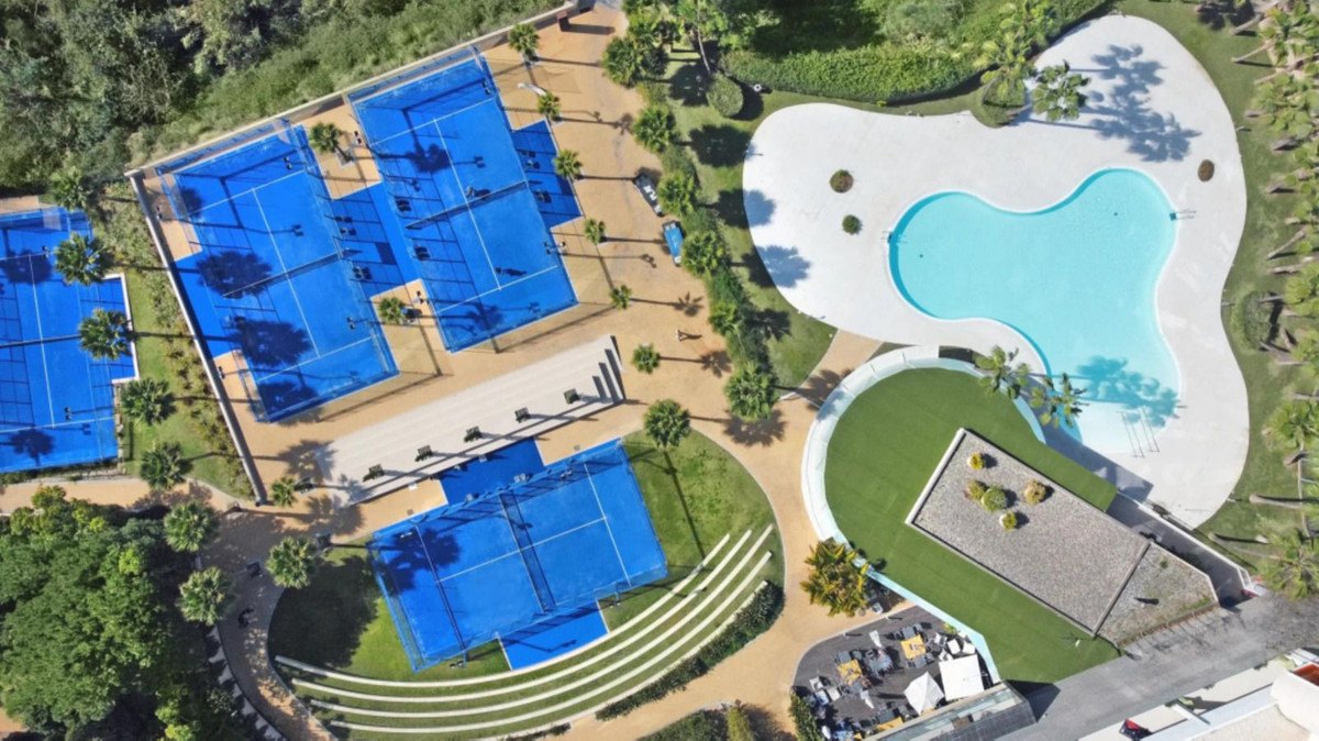 Padel courts and a lagoon pool, from above