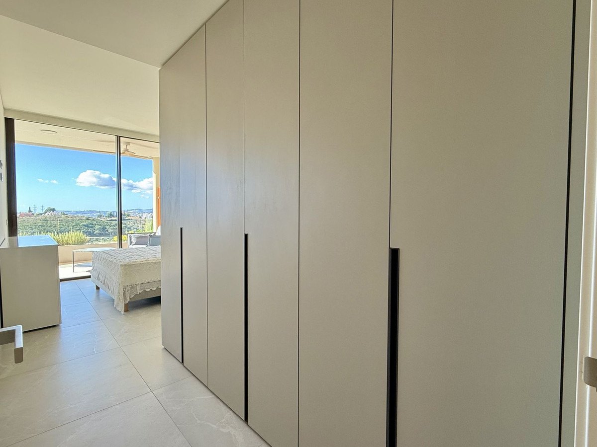 A wall of built-in wardrobes