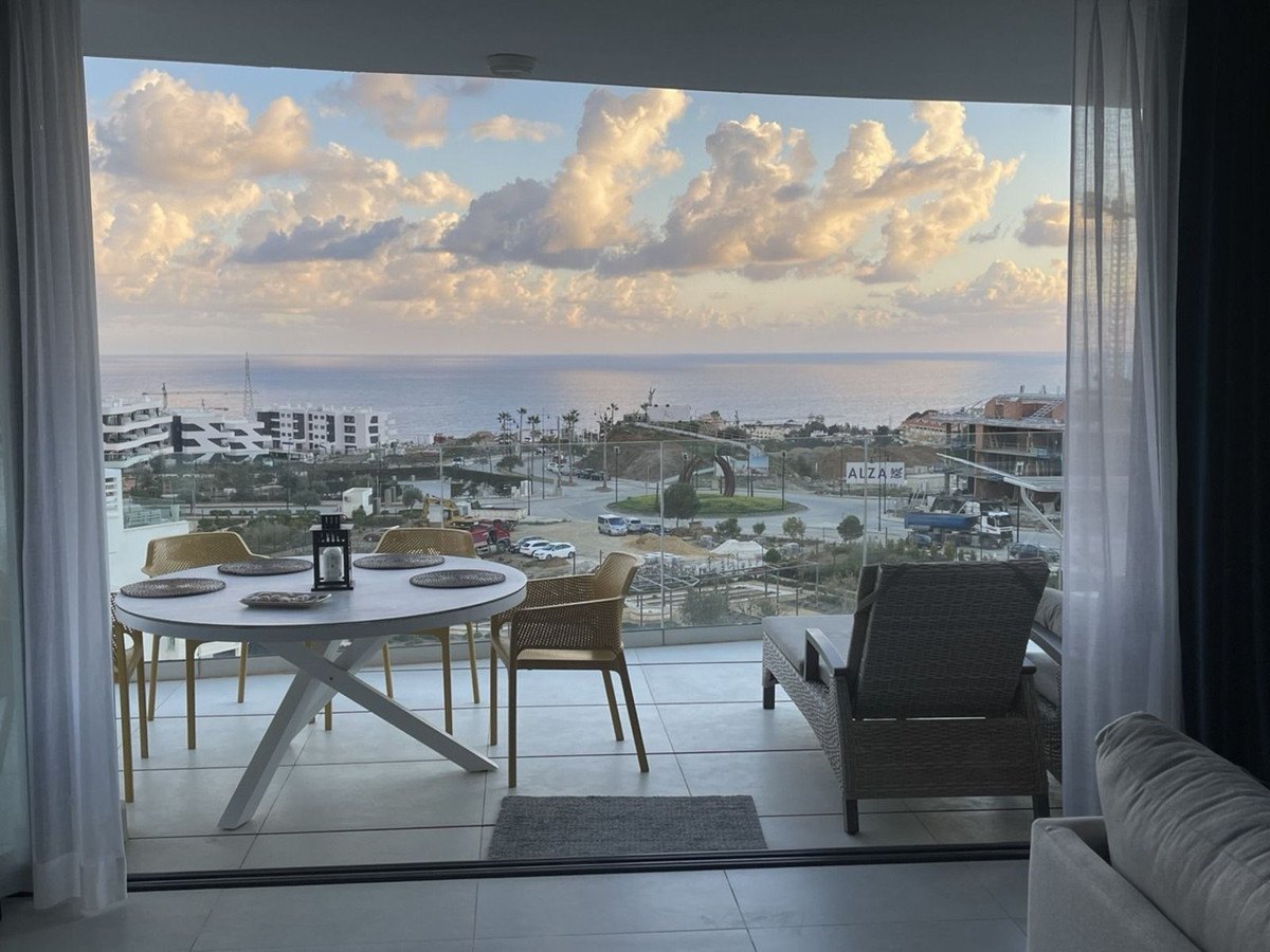 Lunch on the terrace, the sea and the clouds beyond