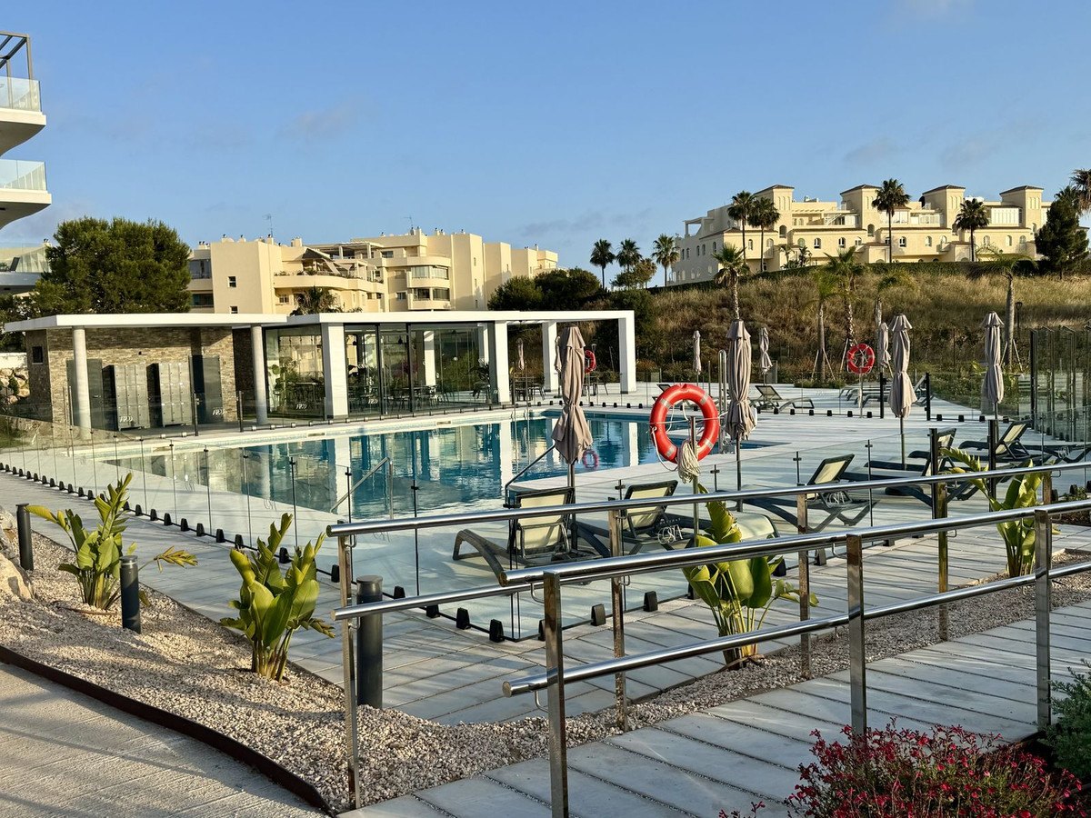A pool, seen from the garden walk