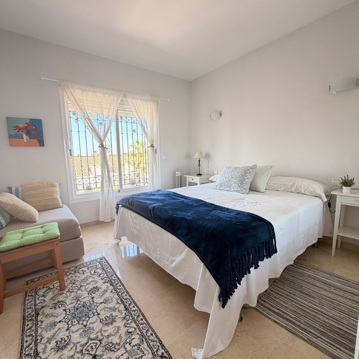 A bedroom dressed in blue