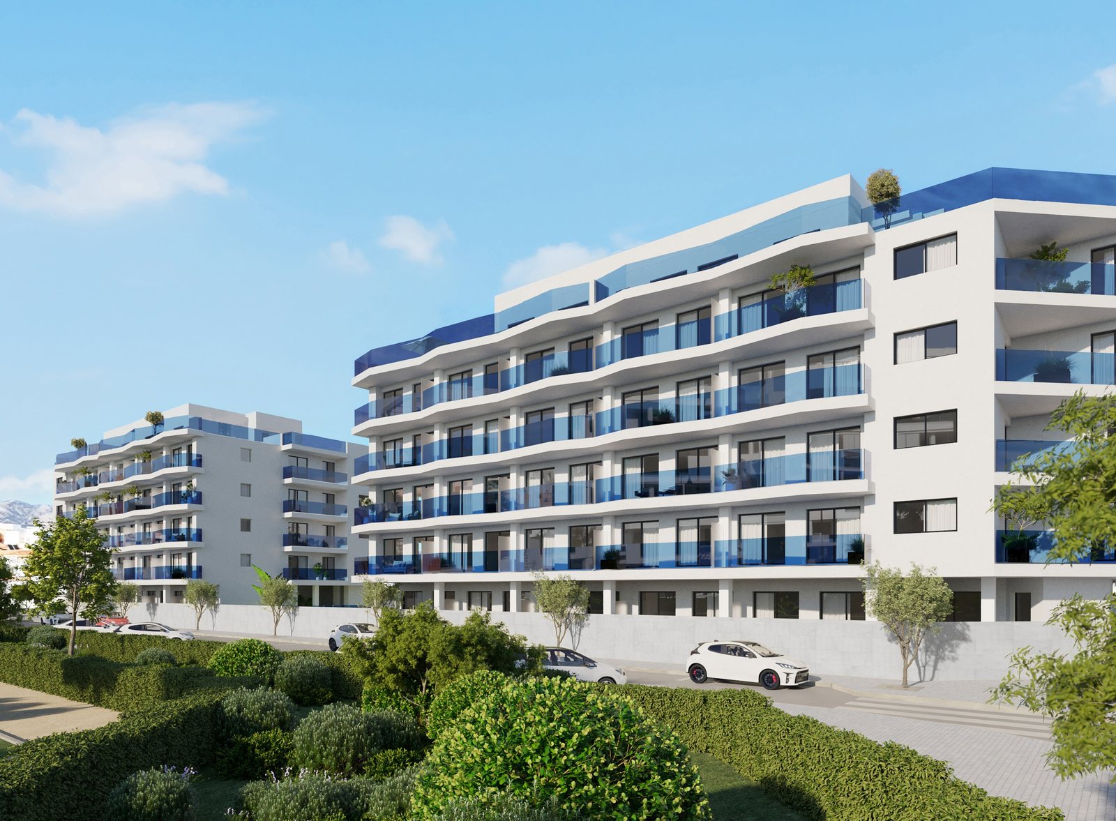 The white blocks with their cobalt-blue balconies, seen from the street — computer-generated image