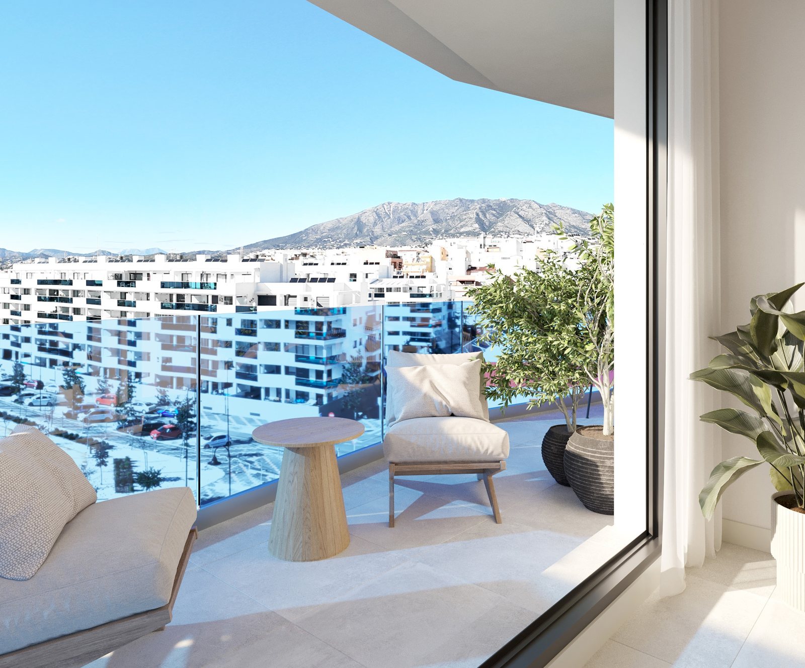 A terrace with lounge chairs looking over the town to the hills — computer-generated image