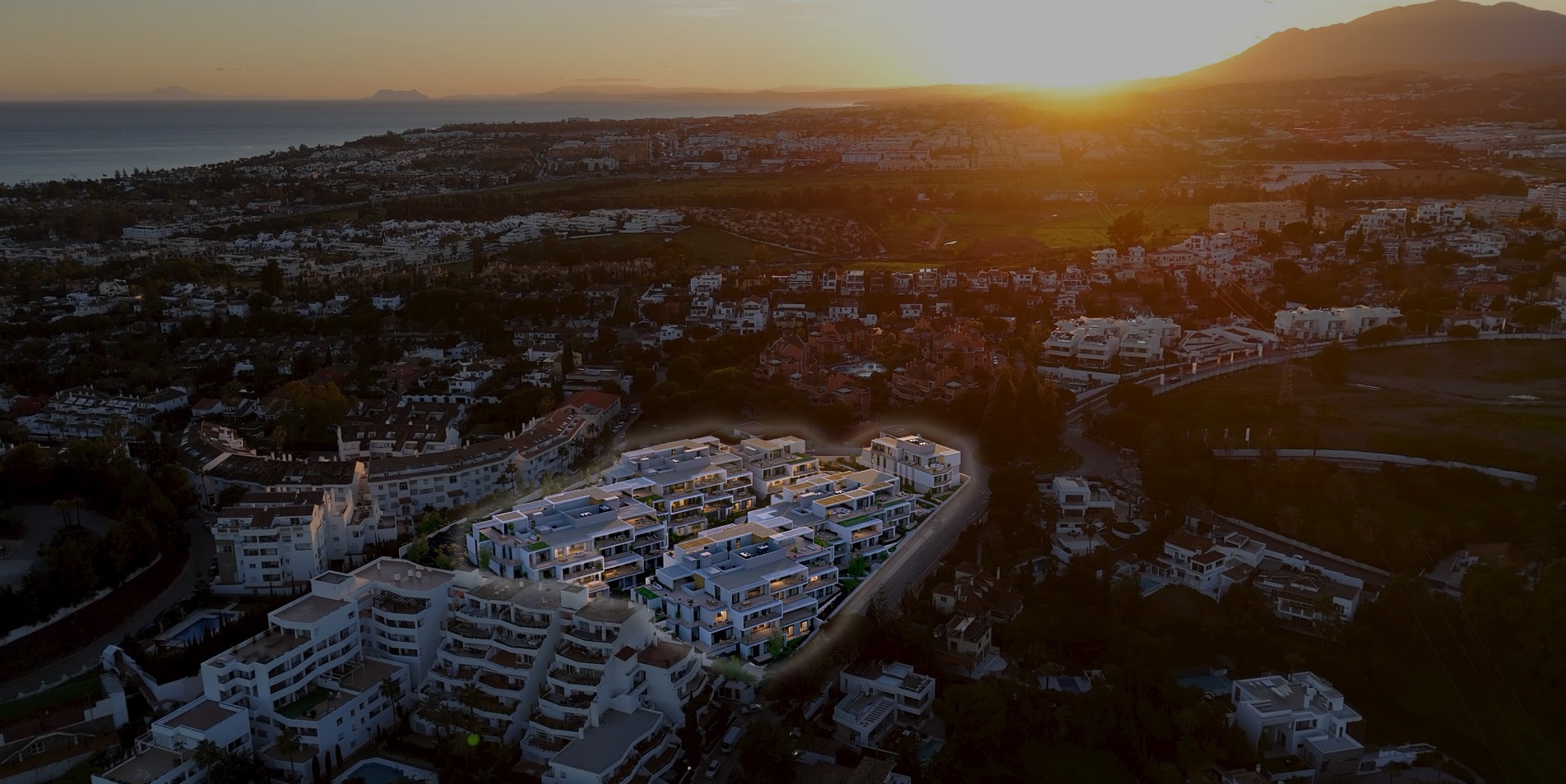 1–4 bedroom apartments in Marbella at sunset, with Gibraltar on the horizon