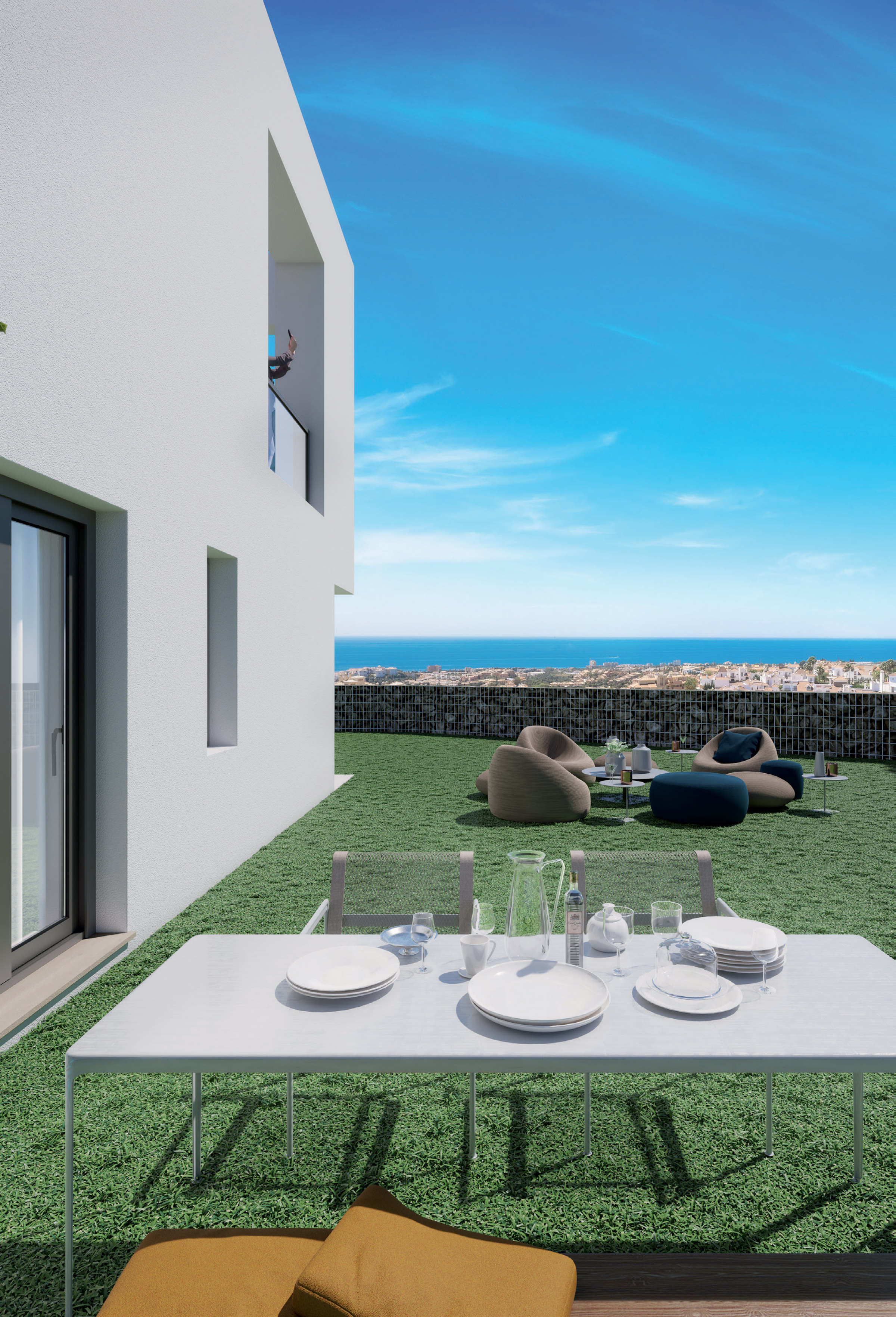 A garden terrace laid for lunch, the house behind